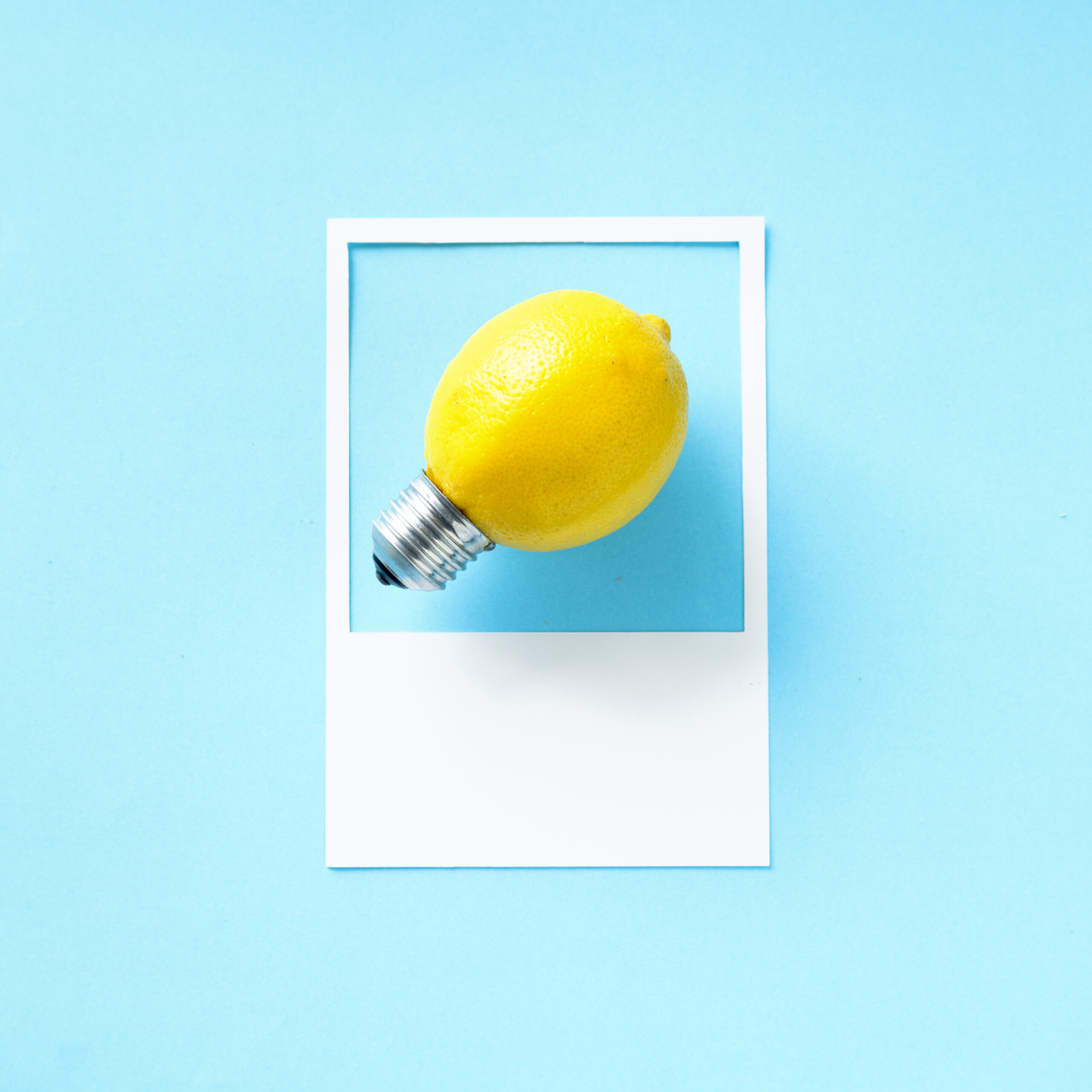 A lemon light bulb in a frame